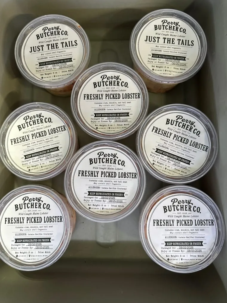 Containers of freshly picked lobster meat at Perry Butcher Co., each labeled Freshly Picked Lobster or Just the Tails